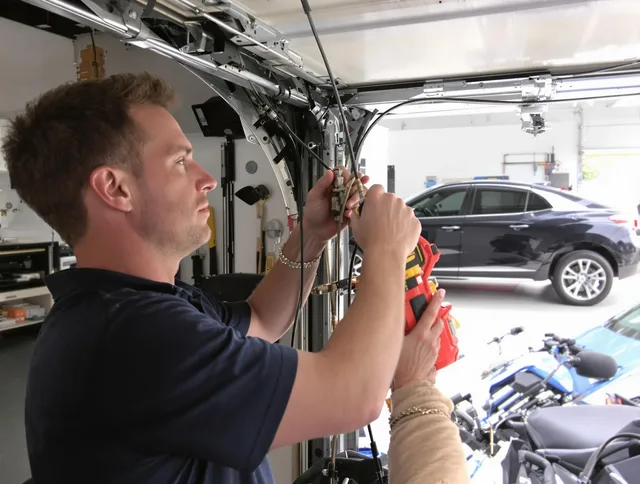 Lake Wylie Garage Door Repair safety certified technician performing cable replacement in Lake Wylie